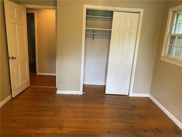 3794 W Hayward Ct, Tucker, GA 30084 - unfurnished bedroom featuring wood finished floors, baseboards, and a closet