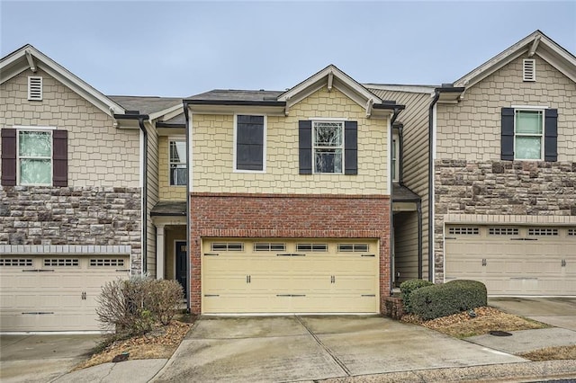 view of property featuring driveway and an attached garage