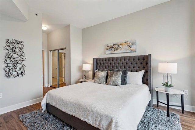 bedroom featuring hardwood / wood-style flooring and a closet