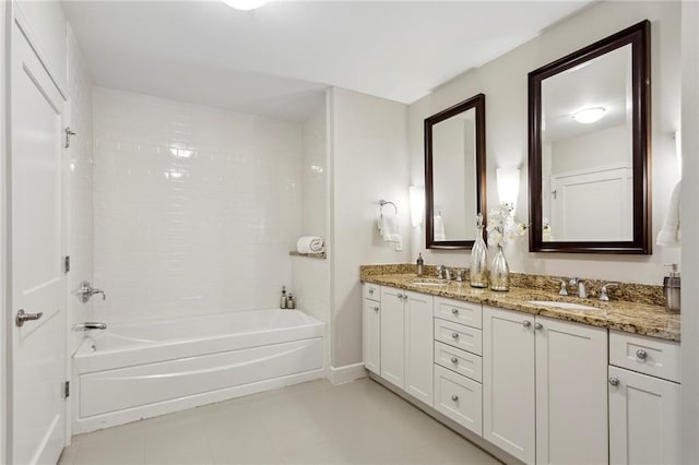 bathroom featuring tile patterned floors, vanity, and washtub / shower combination