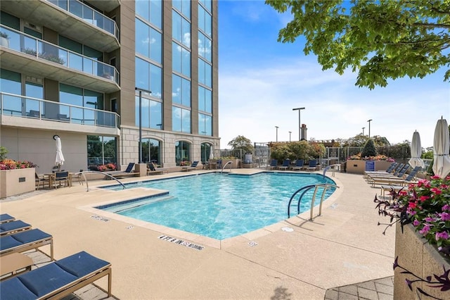 view of swimming pool featuring a patio area