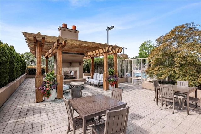 view of patio / terrace with a pergola and an outdoor living space with a fireplace