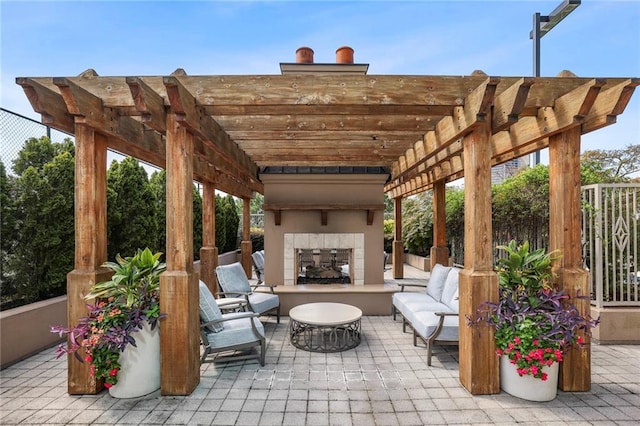 view of patio / terrace featuring a pergola and an outdoor living space with a fireplace