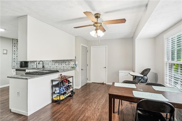 1752 Shadybrook Ct, Lawrenceville, GA 30043 - office area with a ceiling fan, dark wood-style flooring, baseboards, and a sink