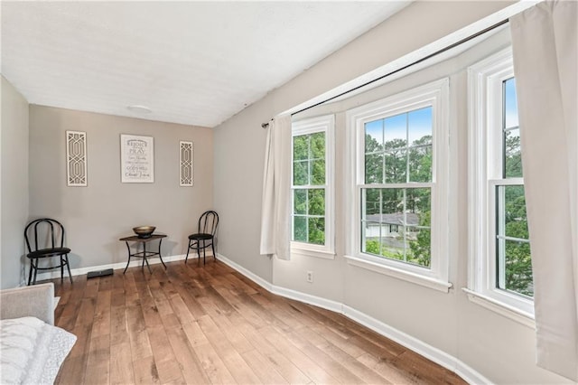 1752 Shadybrook Ct, Lawrenceville, GA 30043 - living area with plenty of natural light, hardwood / wood-style flooring, and baseboards