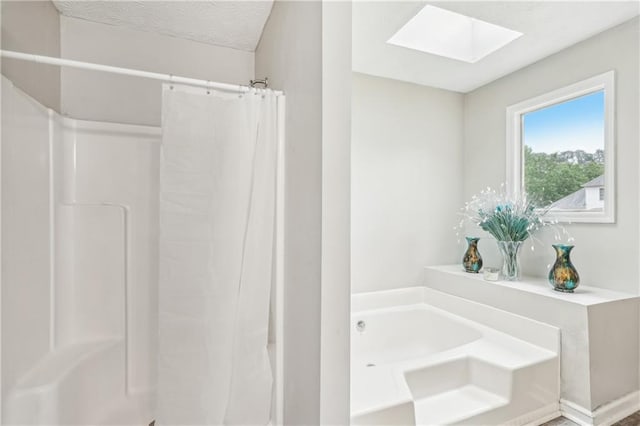 1752 Shadybrook Ct, Lawrenceville, GA 30043 - bathroom featuring a skylight, a bath, and a shower with curtain