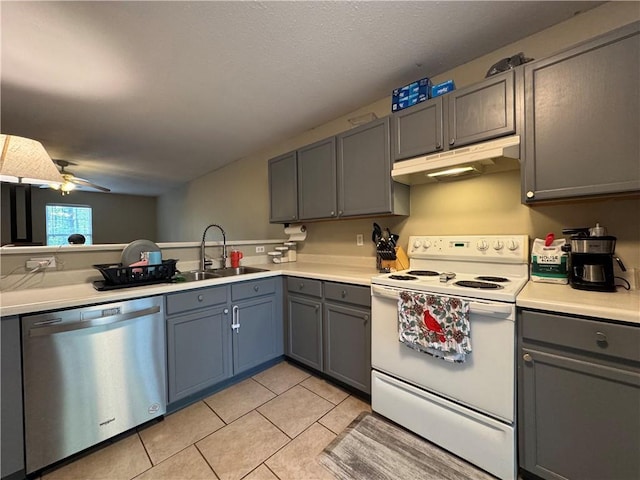 kitchen with gray cabinets, under cabinet range hood, electric stove, dishwasher, and a sink