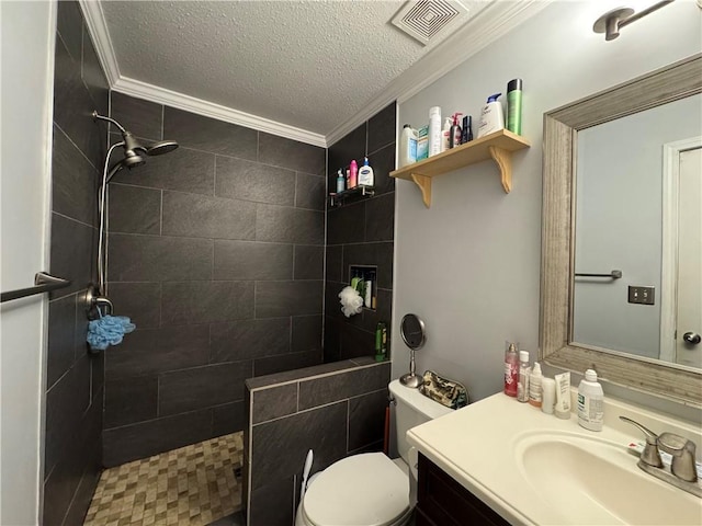 full bathroom featuring a textured ceiling, vanity, ornamental molding, visible vents, and walk in shower