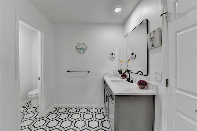 bathroom with vanity and toilet