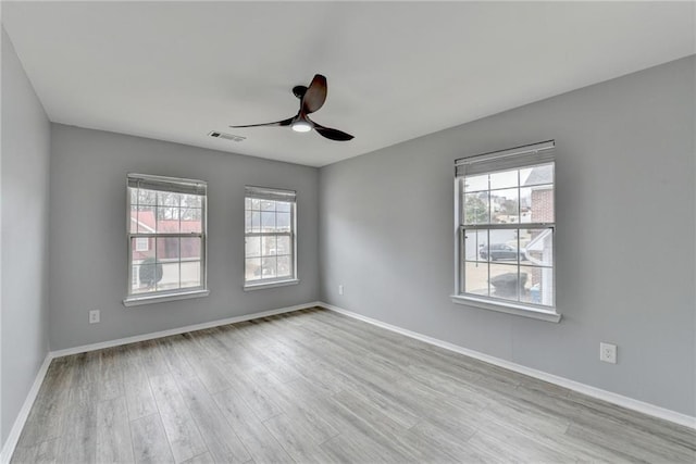 unfurnished room featuring ceiling fan and light wood-type flooring