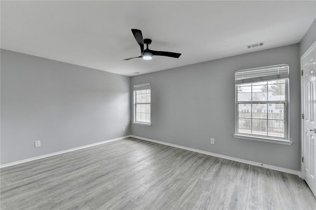 unfurnished room with light hardwood / wood-style flooring and ceiling fan