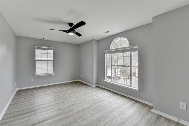 unfurnished room featuring light hardwood / wood-style flooring and ceiling fan