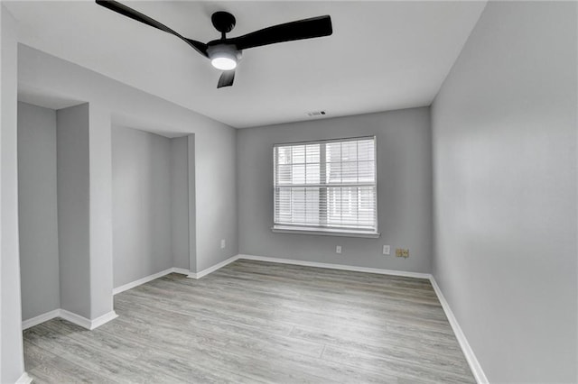 unfurnished room featuring ceiling fan and light hardwood / wood-style flooring