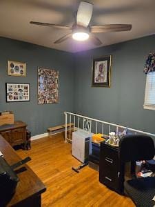 interior space with hardwood / wood-style floors and ceiling fan