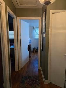 corridor with dark hardwood / wood-style floors