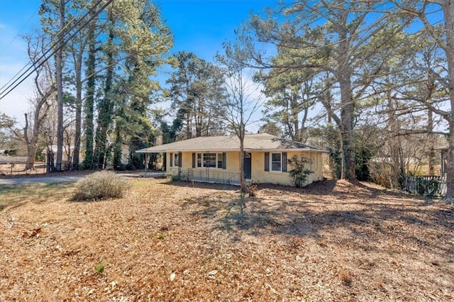 single story home with a porch