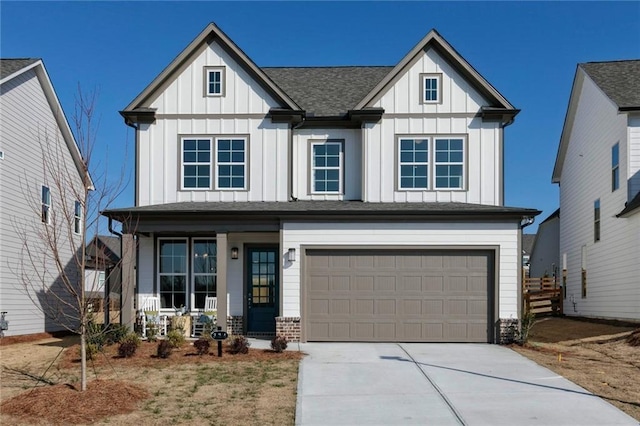 modern farmhouse style home featuring a garage, concrete driveway, a porch, and board and batten siding