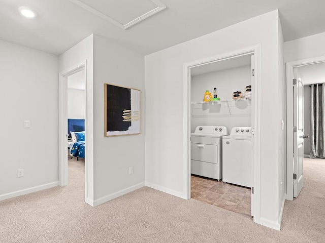 bedroom with a spacious closet, light carpet, and a closet