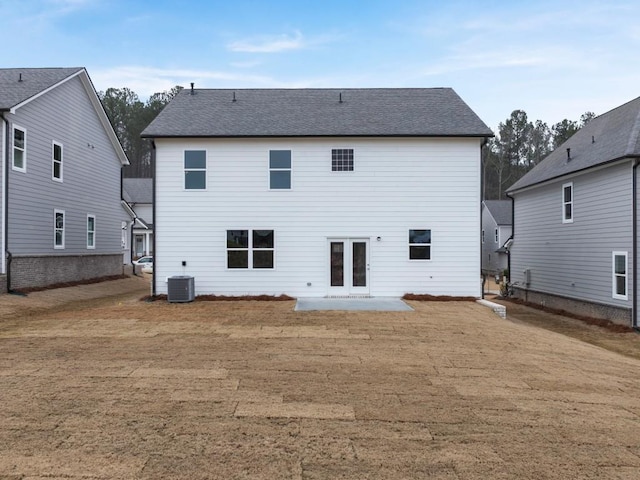 rear view of property featuring ceiling fan, a patio, and a covered pool