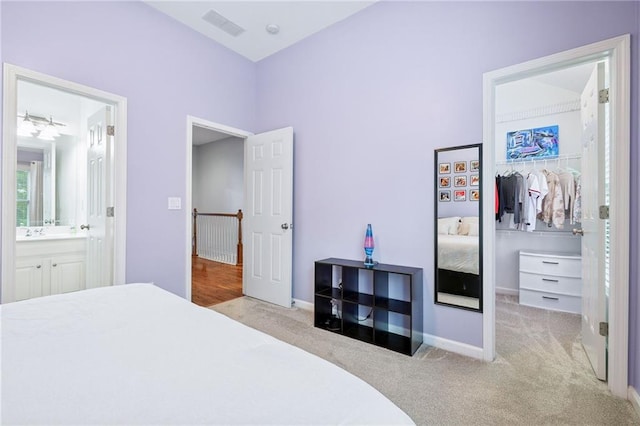 5710 Waters Edge Trl, Roswell, GA 30075 - carpeted bedroom featuring a closet, ensuite bath, and a spacious closet