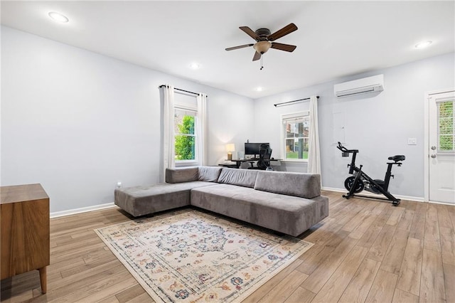 5710 Waters Edge Trl, Roswell, GA 30075 - living room with a wall mounted air conditioner, a ceiling fan, healthy amount of natural light, light wood-style flooring, and recessed lighting