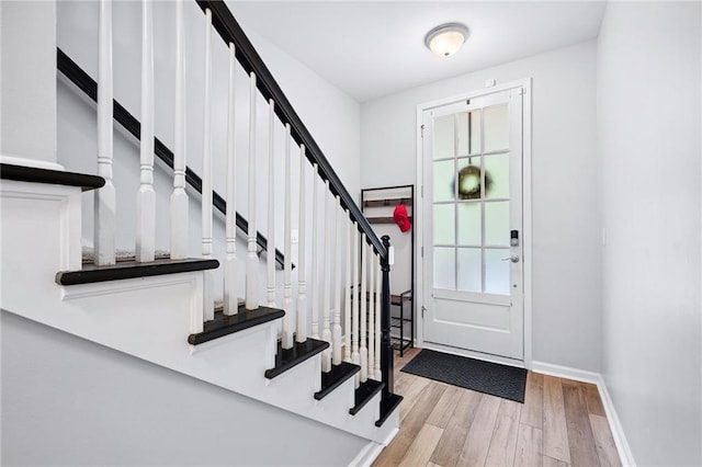 5710 Waters Edge Trl, Roswell, GA 30075 - entryway with wood finished floors and stairway