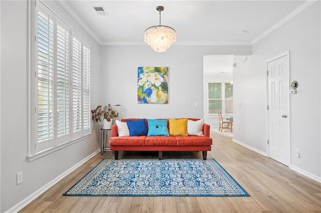 5710 Waters Edge Trl, Roswell, GA 30075 - living area featuring wood finished floors, crown molding, and a chandelier