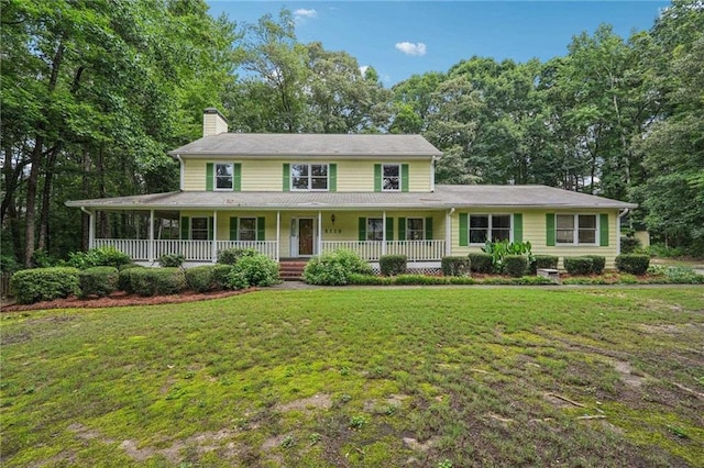 2110 Waterloo Cir, Lawrenceville, GA 30043 - view of front of home with a chimney, a porch, and a front yard