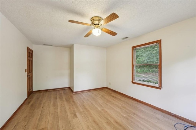 2110 Waterloo Cir, Lawrenceville, GA 30043 - unfurnished room featuring light wood-style floors, a textured ceiling, and ceiling fan