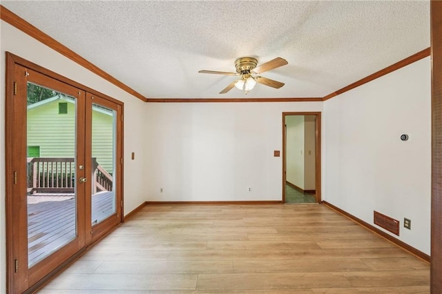 2110 Waterloo Cir, Lawrenceville, GA 30043 - unfurnished room featuring french doors, light wood-style floors, ornamental molding, a textured ceiling, and a ceiling fan