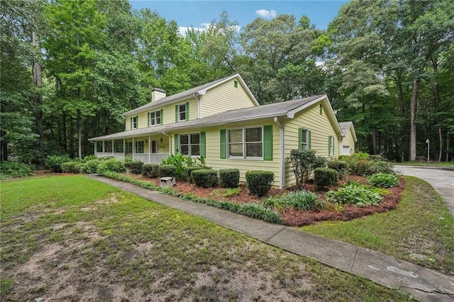2110 Waterloo Cir, Lawrenceville, GA 30043 - view of front of property featuring a chimney and a front yard