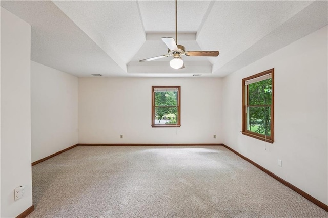 2110 Waterloo Cir, Lawrenceville, GA 30043 - carpeted spare room with a raised ceiling, a ceiling fan, and a textured ceiling