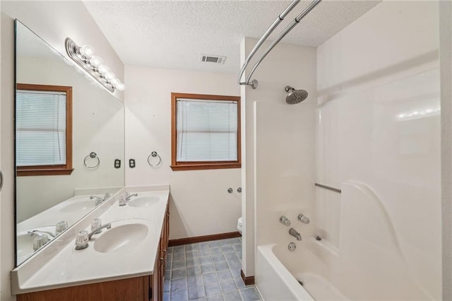2110 Waterloo Cir, Lawrenceville, GA 30043 - full bathroom with a textured ceiling,  shower combination, double vanity, and tile patterned flooring