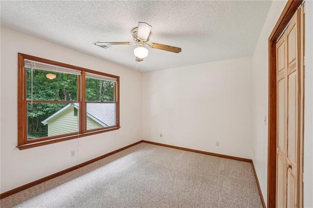2110 Waterloo Cir, Lawrenceville, GA 30043 - carpeted spare room featuring ceiling fan and a textured ceiling