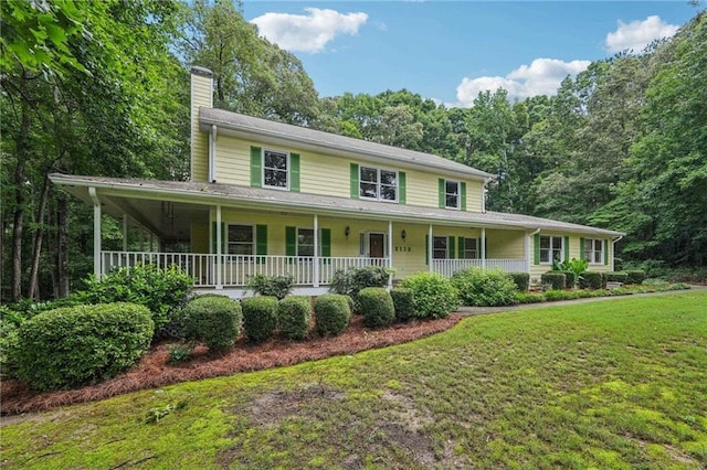 2110 Waterloo Cir, Lawrenceville, GA 30043 - view of front of property featuring a chimney, a front yard, and a porch