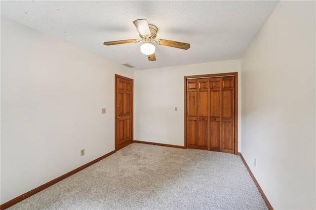 2110 Waterloo Cir, Lawrenceville, GA 30043 - unfurnished bedroom with light carpet, a closet, and a ceiling fan