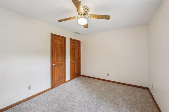 2110 Waterloo Cir, Lawrenceville, GA 30043 - carpeted empty room with baseboards and a ceiling fan
