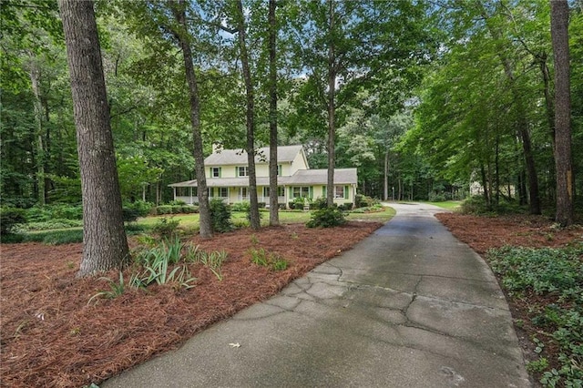 2110 Waterloo Cir, Lawrenceville, GA 30043 - view of front of home featuring a chimney and asphalt driveway