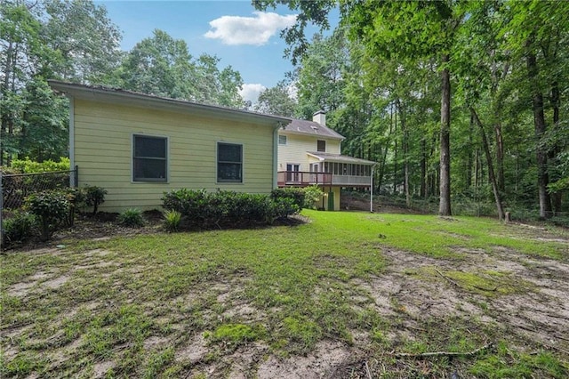 2110 Waterloo Cir, Lawrenceville, GA 30043 - back of property featuring a wooden deck and a chimney