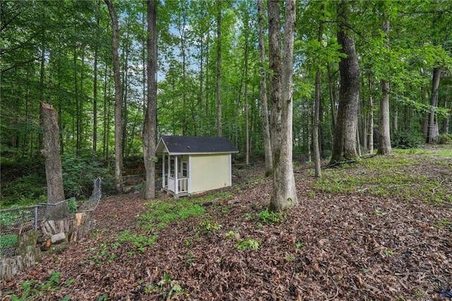 2110 Waterloo Cir, Lawrenceville, GA 30043 - view of yard with a wooded view and a storage unit