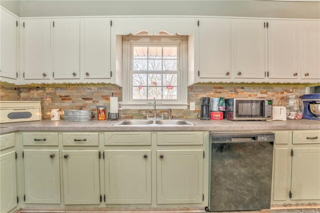 kitchen with tasteful backsplash, black dishwasher, and sink