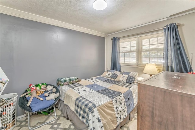 bedroom with crown molding and a textured ceiling