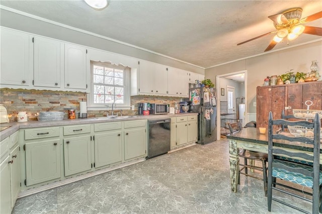 kitchen featuring sink, crown molding, ceiling fan, tasteful backsplash, and black appliances