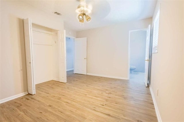 interior space with light wood finished floors, visible vents, baseboards, and a closet