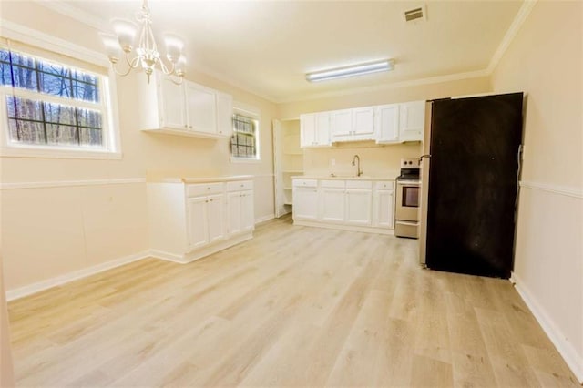 kitchen featuring light wood-type flooring, ornamental molding, freestanding refrigerator, electric range, and white cabinets