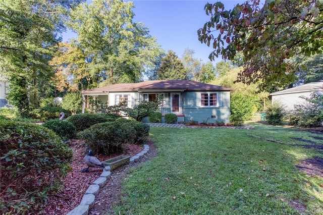 ranch-style home with a front lawn