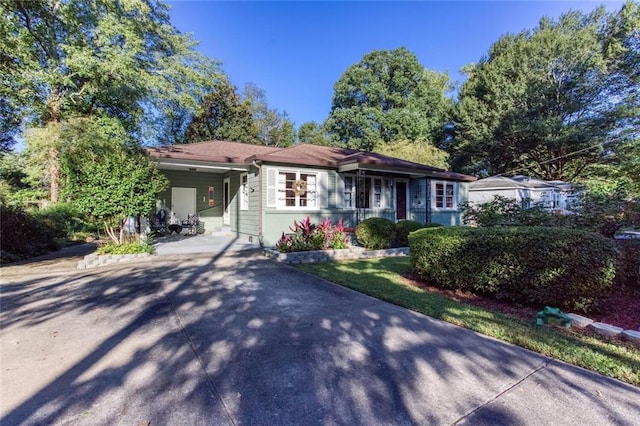 ranch-style house with a carport