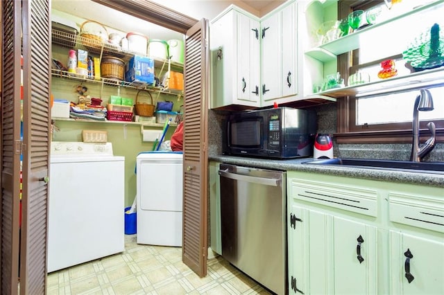 washroom with independent washer and dryer and sink