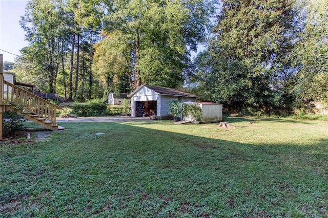 view of yard featuring a shed and a garage