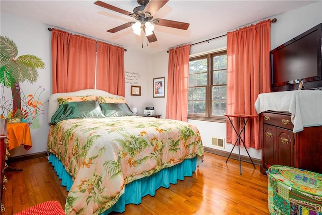 bedroom featuring wood-type flooring and ceiling fan